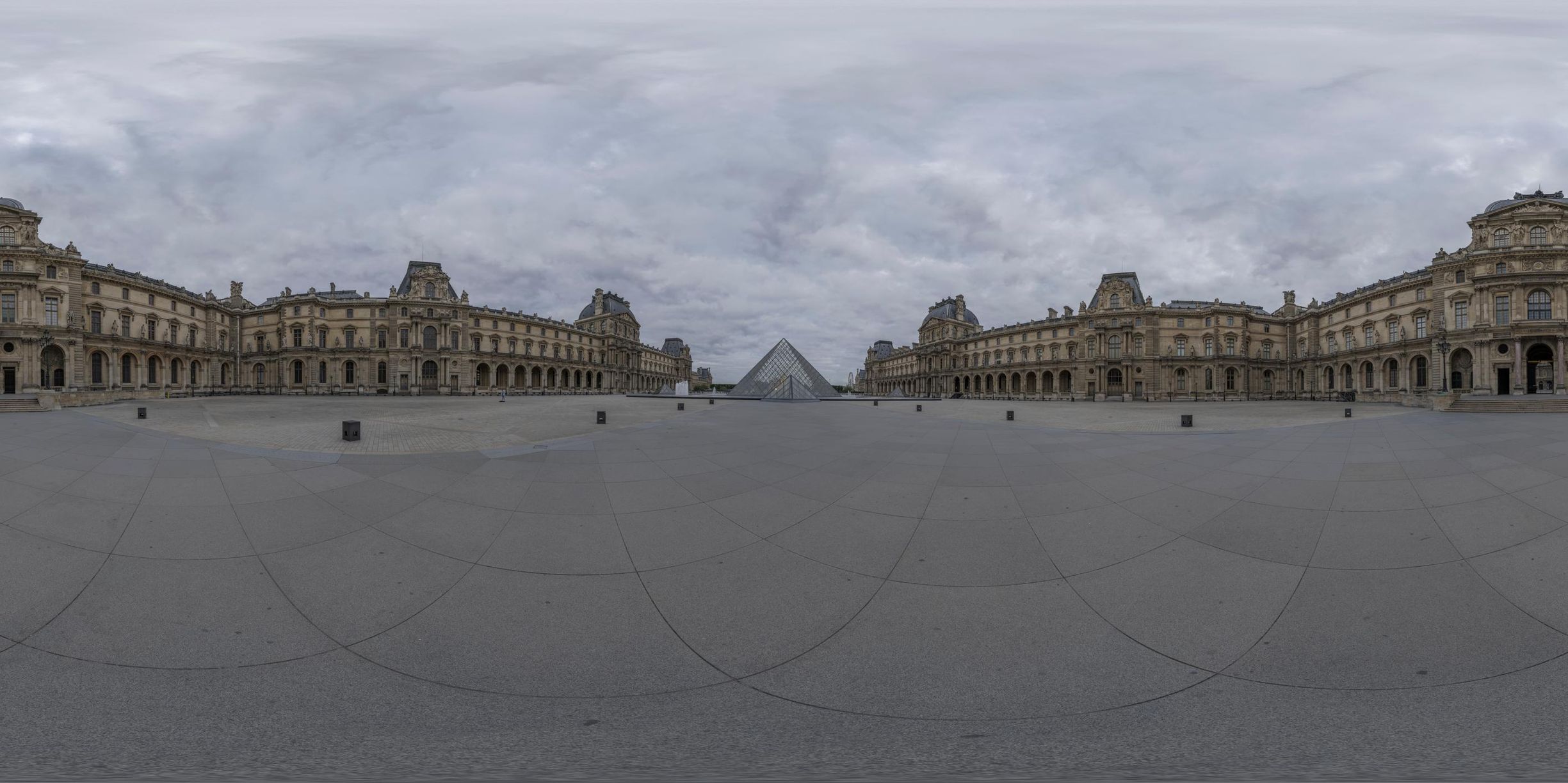 an abstract view of some buildings and a cloudy sky in paris's louvre park