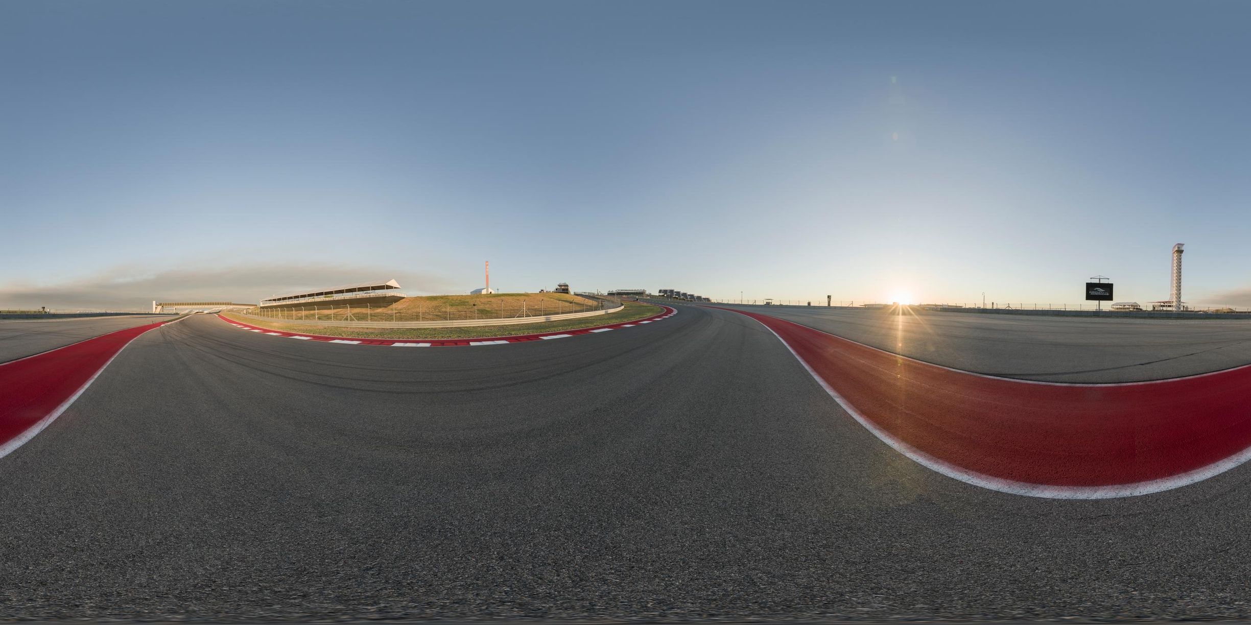 a picture taken while flying a motorcycle around the track at the same time as it is on