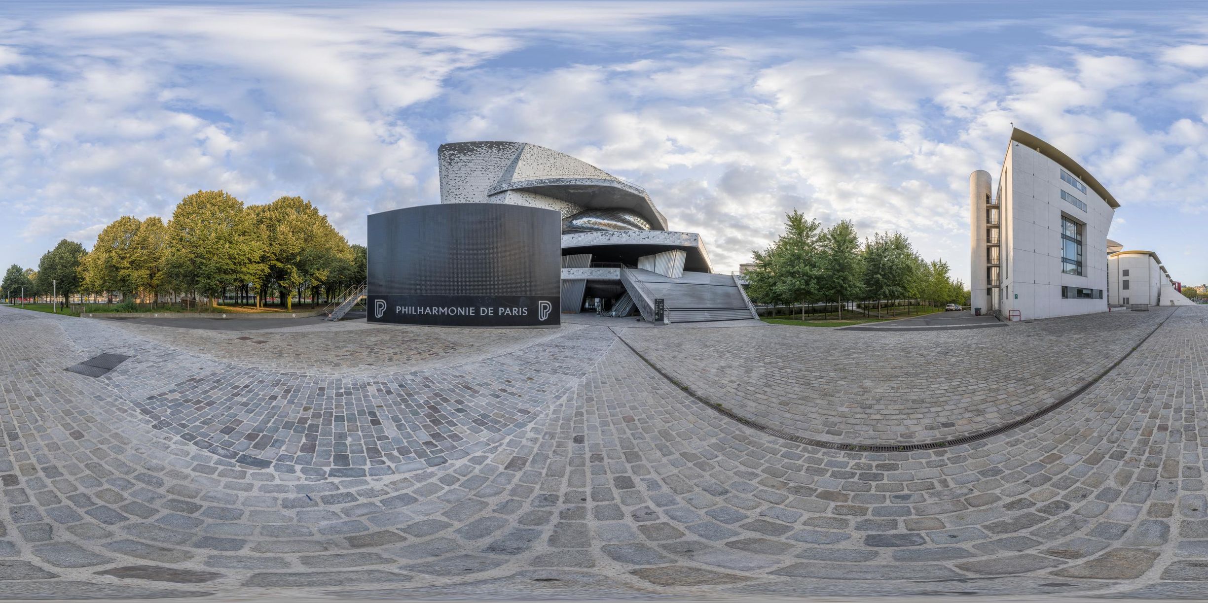 a fisheye lens image of the exterior of the museum in prague, where a monument has been turned