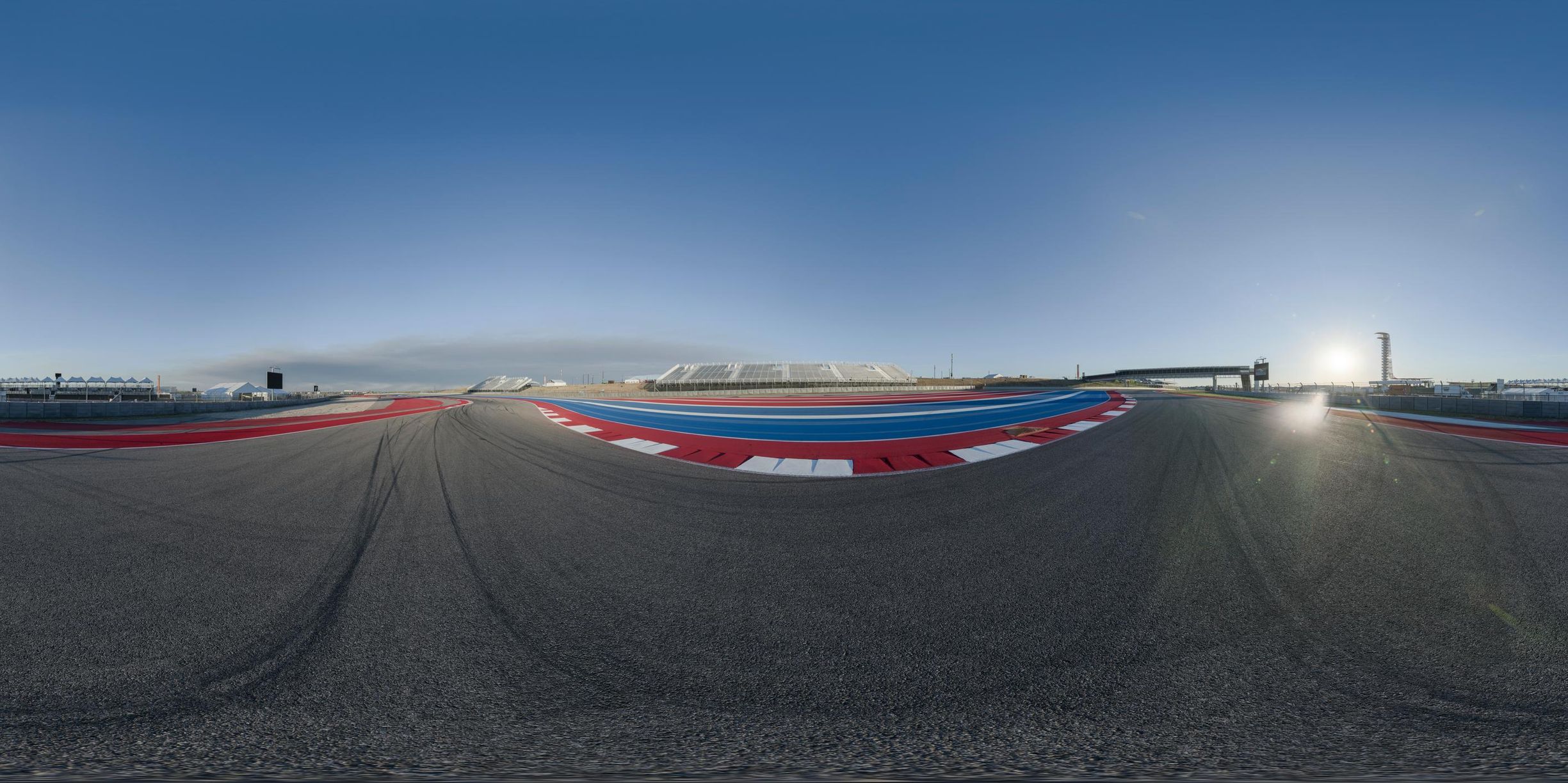 this is a 360 - view shot of a race track, from behind, as it stretches out into the distance