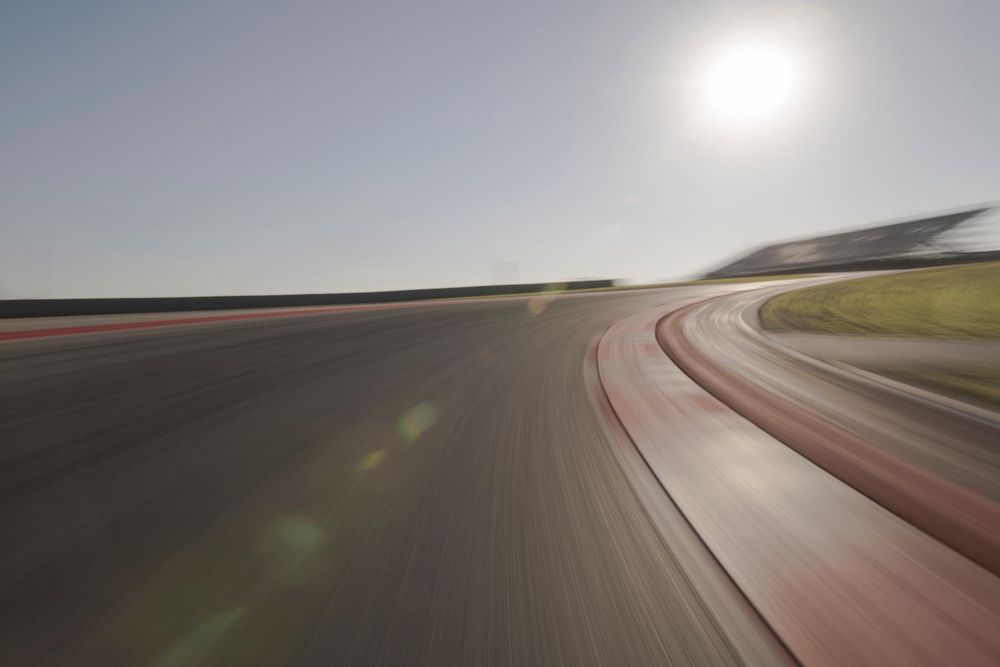 Race Track with Blurred Car and Sun - HDRi Maps and Backplates