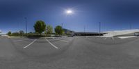 a 360 - vr view of a parking lot and buildings from a vehicle window in the middle