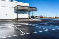 a parking lot that has been completely coated with concrete and black asphalting off of it