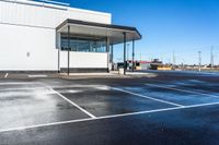 a parking lot that has been completely coated with concrete and black asphalting off of it