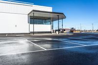 a parking lot that has been completely coated with concrete and black asphalting off of it