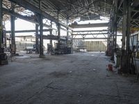 the inside of an abandoned factory with lots of machinery and people working on it and some workers