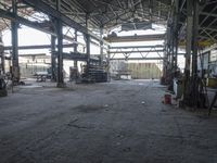 the inside of an abandoned factory with lots of machinery and people working on it and some workers