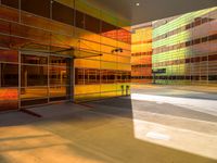 an abstract shot of an outside building with bright colors and lights shining down on the building