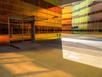 an abstract shot of an outside building with bright colors and lights shining down on the building