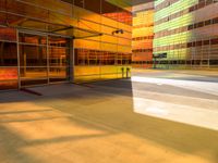 an abstract shot of an outside building with bright colors and lights shining down on the building