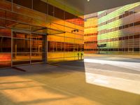 an abstract shot of an outside building with bright colors and lights shining down on the building