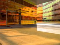 an abstract shot of an outside building with bright colors and lights shining down on the building