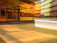 an abstract shot of an outside building with bright colors and lights shining down on the building