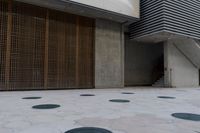 a large parking garage with several different doors to open on the side of it's walk way