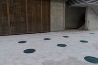 a large parking garage with several different doors to open on the side of it's walk way