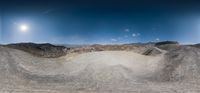 there is an image of an aerial panoramic view in the desert area of a mountain