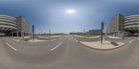 the three large buildings are shown in this 360 - shot photograph at an angle and on three sides, there is a small road