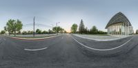 a panoramic shot shows the intersection of a street and building with red arrows