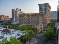 several large empty parking spaces in the city with buildings nearby in front of them -