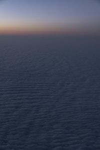 Aerial View of Dawn Over Ocean Horizon