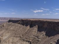 a person riding a horse down the middle of a canyon in western utah, usa