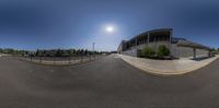 the big empty car park is being filmed by a fisheye lens shoter by a wide angle lens