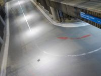 the light shines on an empty city street at night in this aerial view of traffic