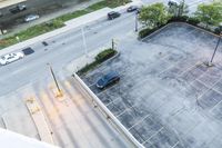 the view from the top floor of a hotel room and garage looking down onto the empty parking lot