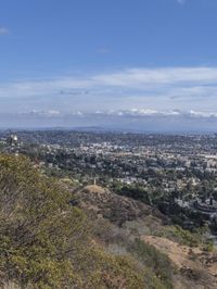 a view of los from the top of a mountain, overlooking a cityscape