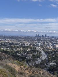 a view of los from the top of a mountain, overlooking a cityscape