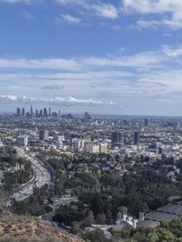 a view of los from the top of a mountain, overlooking a cityscape