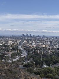 a view of los from the top of a mountain, overlooking a cityscape