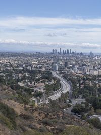 a view of los from the top of a mountain, overlooking a cityscape