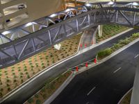 a view of a road and an overpass with traffic passing through it by buildings