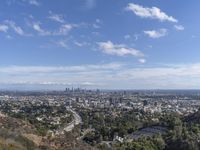 a view of the city and the road from above in this time lapsure shot