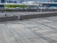 a lot in an empty parking lot at the airport with multiple levels, with no windows on it