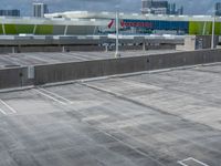 a lot in an empty parking lot at the airport with multiple levels, with no windows on it