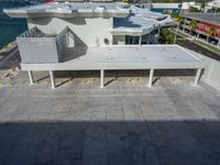 a street view of the buildings and the water from an apartment block's balcony