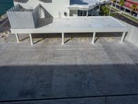 a street view of the buildings and the water from an apartment block's balcony