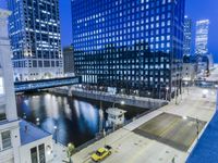 an image of a view from the bridge at night in a city area with skyscrapers