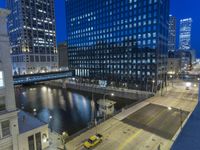 an image of a view from the bridge at night in a city area with skyscrapers