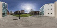 an image of a large circular image of buildings and the sky on a sunny day