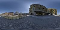 an 360 - view of a building in the middle of a circle of circular buildings