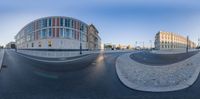 two street views of an empty city and a building in the distance, in this shot from the 360 - angle view