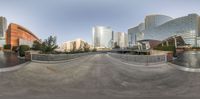 the 360 - view is of a skateboarder doing a trick in a city setting