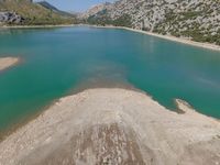 Aerial View of Mountain Lake with Sandy Shoreline