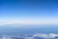 Aerial View of Mountain Range Over the Cloud