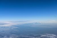 Aerial View of Mountain Range Over the Cloud