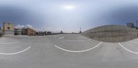 a skateboarder performing a trick in the middle of a half pipe stunt in a circular formation