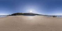 an empty beach with many footprints in the sand on a sunny day with the sun